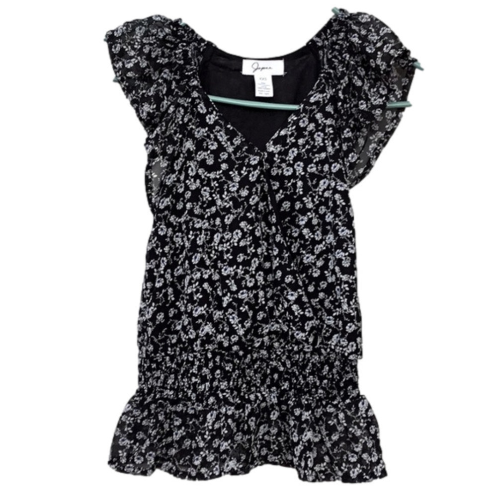 NWT..JAPNA black top with white and blue colored flowers. Women’s size XXS